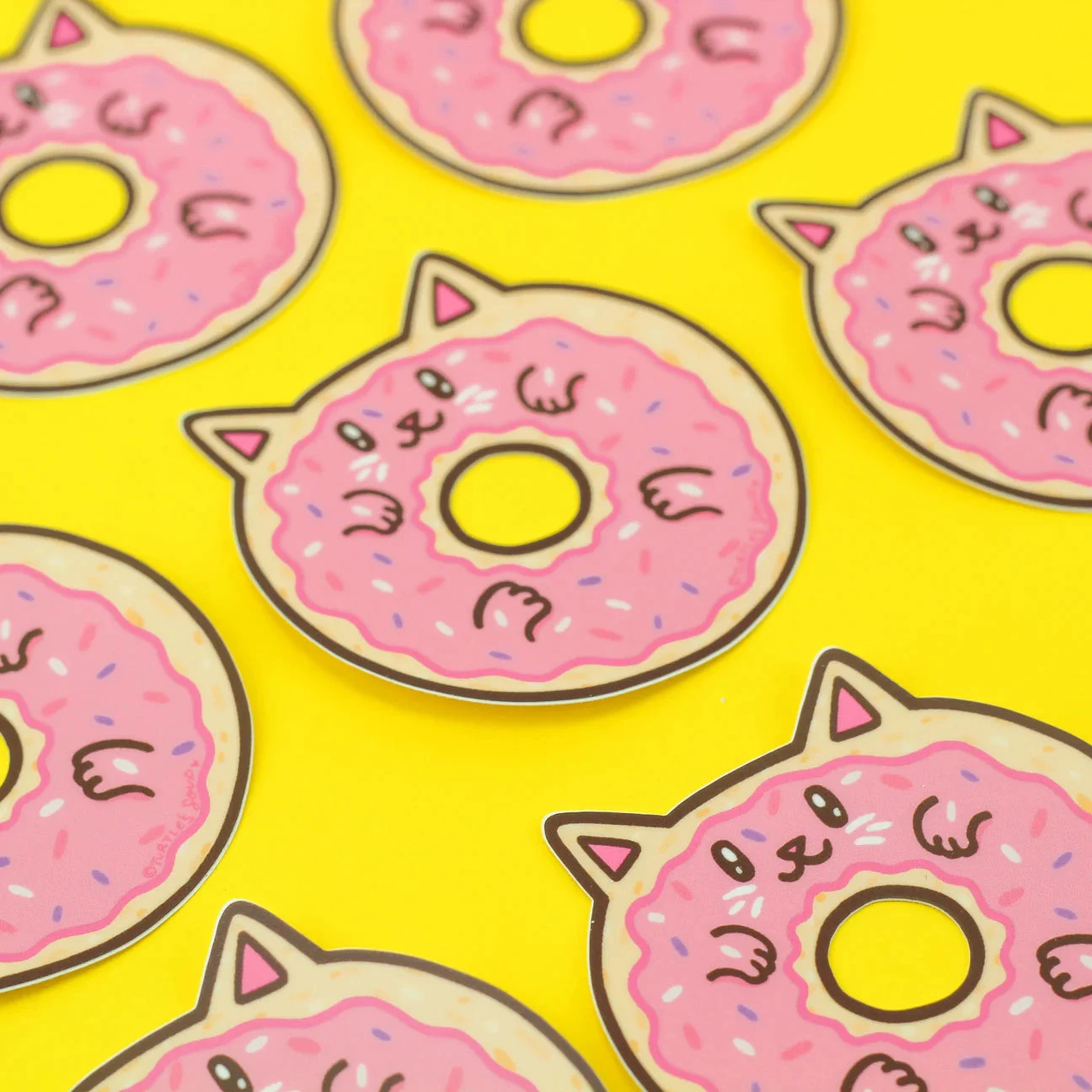 Donut Cat Vinyl Sticker | Turtle's Soup(Donut cat vinyl sticker) Donut Cat Vinyl Sticker | Turtle's Soup(Donut Cat Vinyl Sticker) -Curious Bear Toys yellow backgroud donut kitty stickers laid out